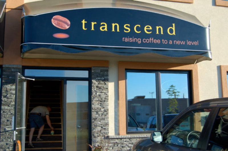 Transcend coffee shop entrance with sign and exterior view